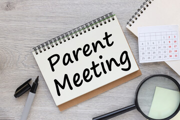 Parent Meeting. text on a sheet of notepad paper on a light table