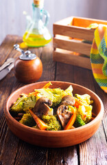 fried vegetables and mushrooms in bowl, stew with mushrooms
