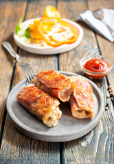 fried rolls with bacon and mushrooms on plate