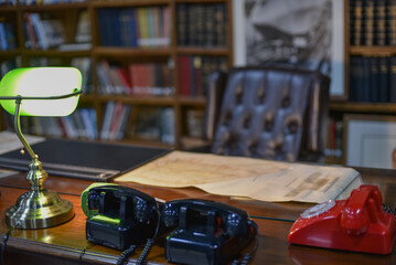 Fototapeta na wymiar Vintage landline telephones in black and red, Retro style vintage office and equipment.