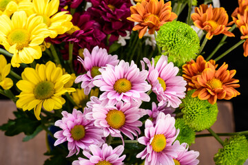 field flower arrangement photographed on black background