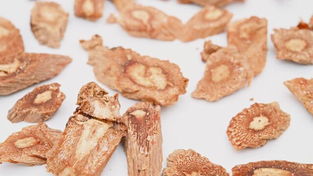 angle view herb DangShenPian or Codonopsis Radix or Pilose Asiabell Root slices rotating