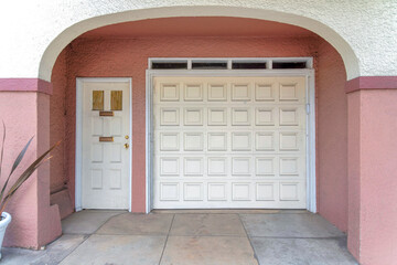 White front door beside the white sectional garage door at San Francisco, California