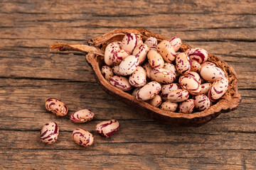 Dried pinto beans in the wooden bowl - Phaseolus vulgaris