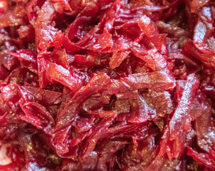 Close-up Texture of red grated beetroot, food background
