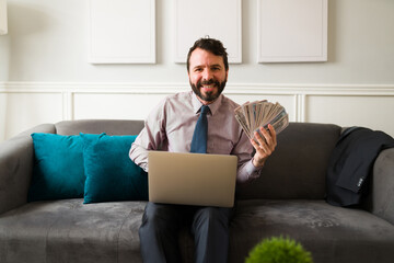 Handsome man earning a lot of money
