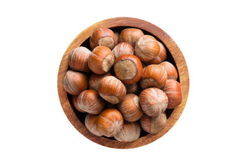shelled hazelnut in wooden bowl isolated on white background. Vegan food, top view.