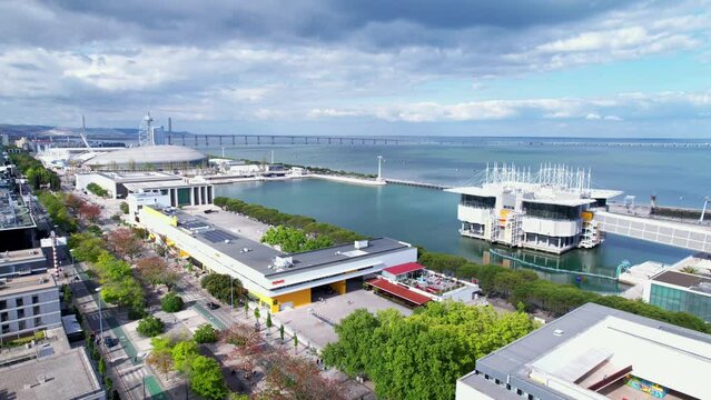 Lisbon, Portugal, April 24, 2022: DRONE AERIAL FOOTAGE: The Parque das Nacoes (Park of Nations), is a neighborhood in Lisbon constructed for the 1998 Lisbon World Exposition.