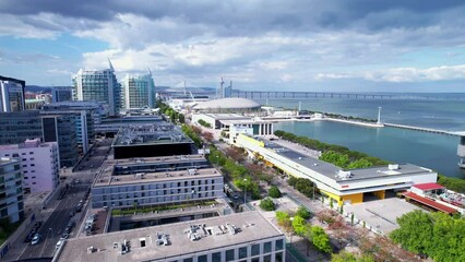 Lisbon, Portugal, April 24, 2022: DRONE AERIAL FOOTAGE: The Parque das Nacoes (Park of Nations), is a neighborhood in Lisbon constructed for the 1998 Lisbon World Exposition.