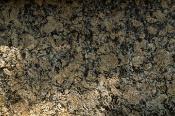 Tile texture with yellowish and black coloring. Top view