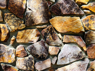 sunny rock stone wall garden path stones shadows sunlight backyard cut stones walkway