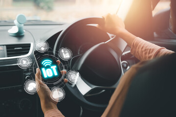 IOT Internet of things, Person hand using smart phone on car with VR screen Internet of things icon background, Digital transformation, Modern technology concept...