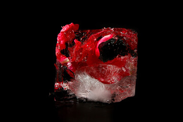 Frozen ice block with rose petals