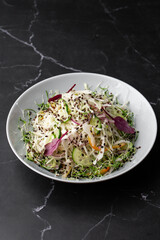 Vegetarian salad. Spring vegan salad with cabbage, cucumber, green onion and parsley. Top view, flat lay, overhead