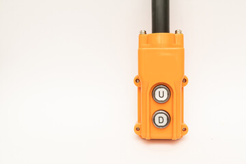 Hoist push button switch in isolated. cranes remote. Up Down hydraulic controller switch. electric remote push button switch of hoist lift or crane for control direction. choose between up or down.