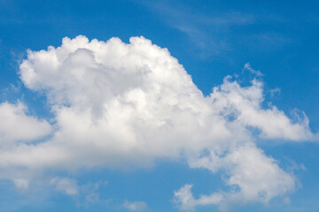 Naklejka na ściany i meble Beautiful blue sky background with tiny clouds