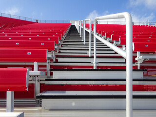 Bleacher stairs and railing heading up to seats