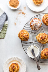 Freshly made cinnamon bun rolls topped with cream cheese icing.