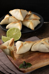 Tasting traditional Arabic sfiha. Selective focus.