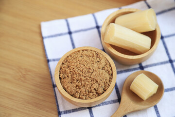 brown sugar powder in bowl from fresh organic sugar cane for being cooking ingredients for healthy eating. selective focus.
