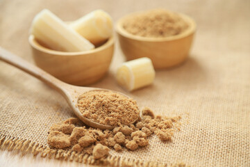 brown sugar powder from fresh organic sugar cane for being cooking ingredients for healthy eating. selective focus.
