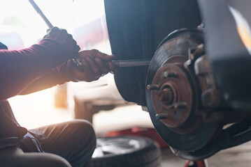 Selective focus disc brake on car, in process of new tire replacement,Car brake repairing in garage