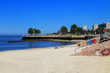 Fototapeta na wymiar Sandy beach along the bank of the Rio de la Plata in Montevideo, Uruguay