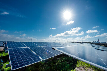 Photovoltaic modules solar power plant on dramatic sunset sky background, Alternative power energy...