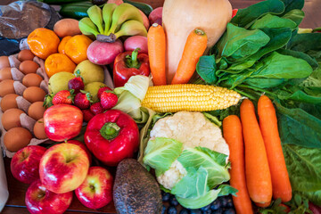 fresh vegetables and fruit. Corn, carrot, capsicum, apple, Potato, cauliflower, pumpkin and oranges