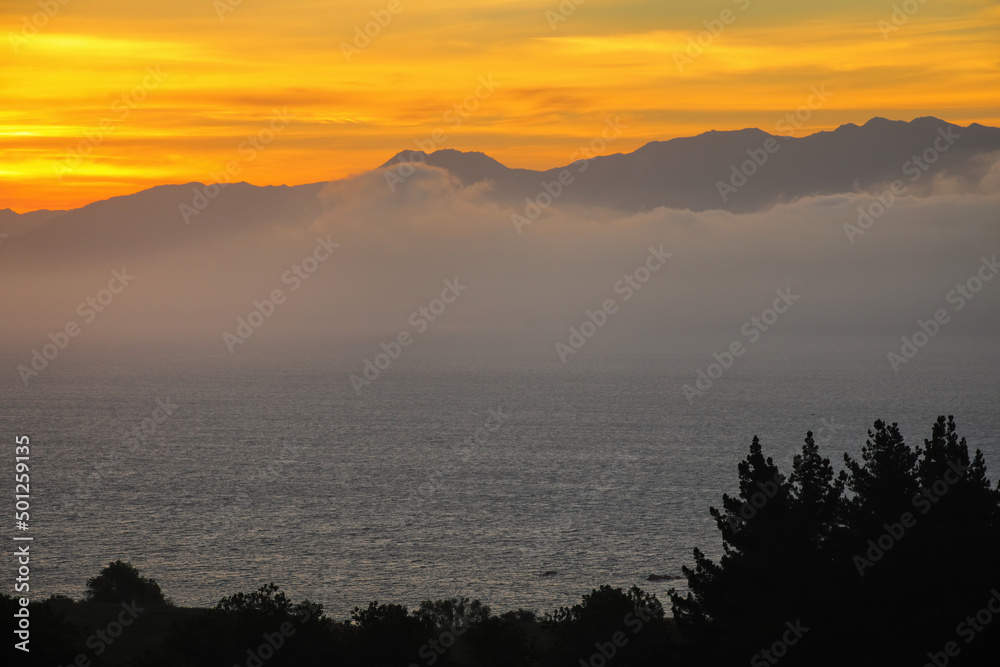 Wall mural sunset over the bay on kaikoura peninsula, south island, new zealand