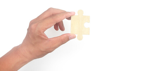 Connecting jigsaw puzzle in  hand