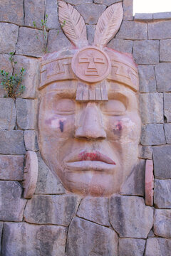 Carving of Inca warrior on a wall in Chivay town, Peru