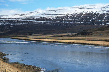 Beautiful nature landscape scenery around Lagarfljot Lake near Egilstadir in Iceland with blue sky...