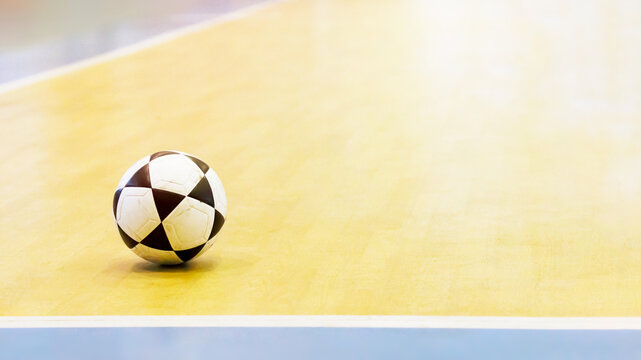 Footballs On The Indoor Gym Floor Background.