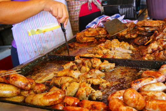 Meat is being cooked for asado at Mercado Cuatro in Asuncion, Paraguay
