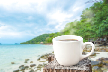 coffee cup over blue sea background.