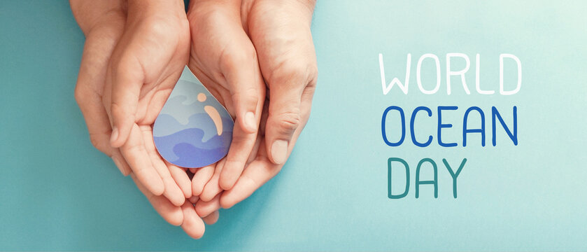 Hands holding water drop, world OCEAN day