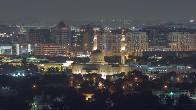 Aerial view of mosque and neighbourhood Deira on a background night timelapse. Dubai, United Arab Emirates