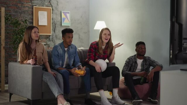 Black man throws up chips watching football with friends