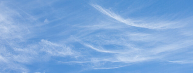 blue sky with white clouds and sun light. Nature background of sky