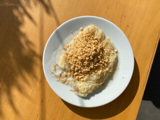Traditional Turkish Dessert Kadayif  with Milk and Hazelnut Powder. Sutlu Nuriye.