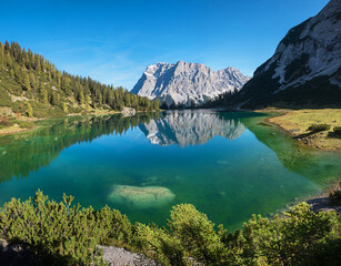 tranquil lake Seebensee and Zugspitze mountain in the morning, tirolean landscape