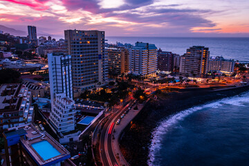 Fototapeta na wymiar Sunset and vibrant skies over the city of Puerto de la Cruz in the north of Tenerife Canary Islands