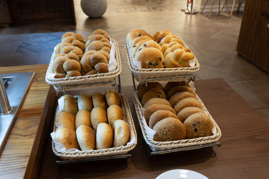 Various types of buns served on a buffet table