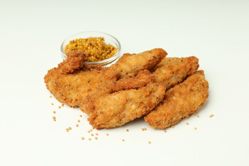 Concept of tasty food with chicken strips on white background