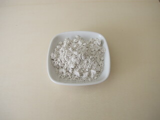 White slurry chalk powder for peeling or mask on a wooden board