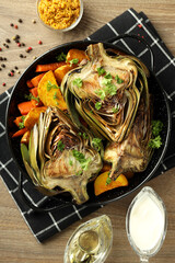 Concept of tasty food with grilled artichoke, top view