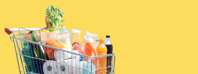 Full shopping cart on yellow background