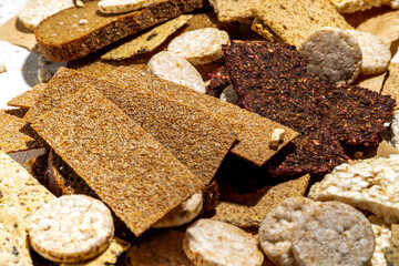 Gluten free allergic diet, celiac disease concept. Collection of various non-gluten different bread, whole grain loaves. Healthy alternative to bread, flatlay copy space