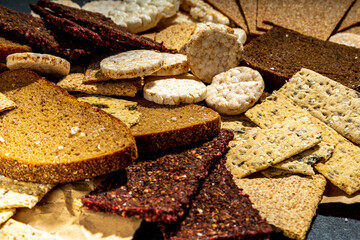 Gluten free allergic diet, celiac disease concept. Collection of various non-gluten different bread, whole grain loaves. Healthy alternative to bread, flatlay copy space